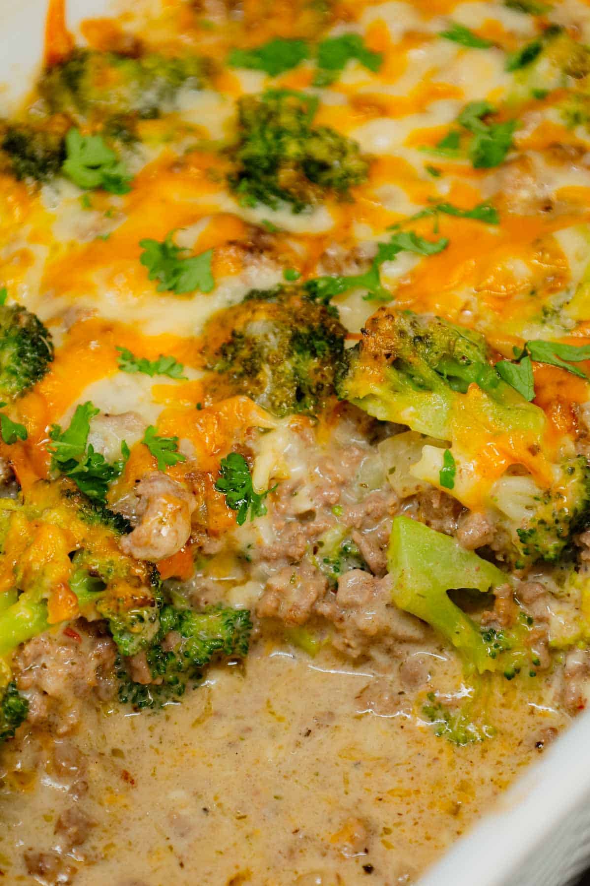 Ground Beef and Broccoli Casserole is a hearty dish loaded with ground beef, broccoli florets, diced onions, alfredo sauce, Italian seasoning, mozzarella cheese and cheddar cheese.