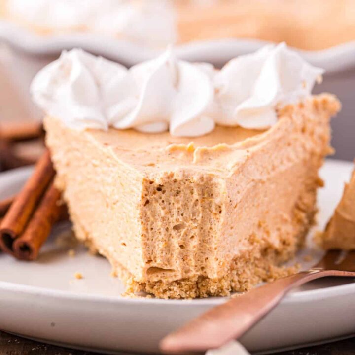 Marshmallow Pumpkin Pie is a delicious no bake pumpkin pie recipe with a graham crust and a filling made from marshmallow fluff, pumpkin puree and Cool Whip.