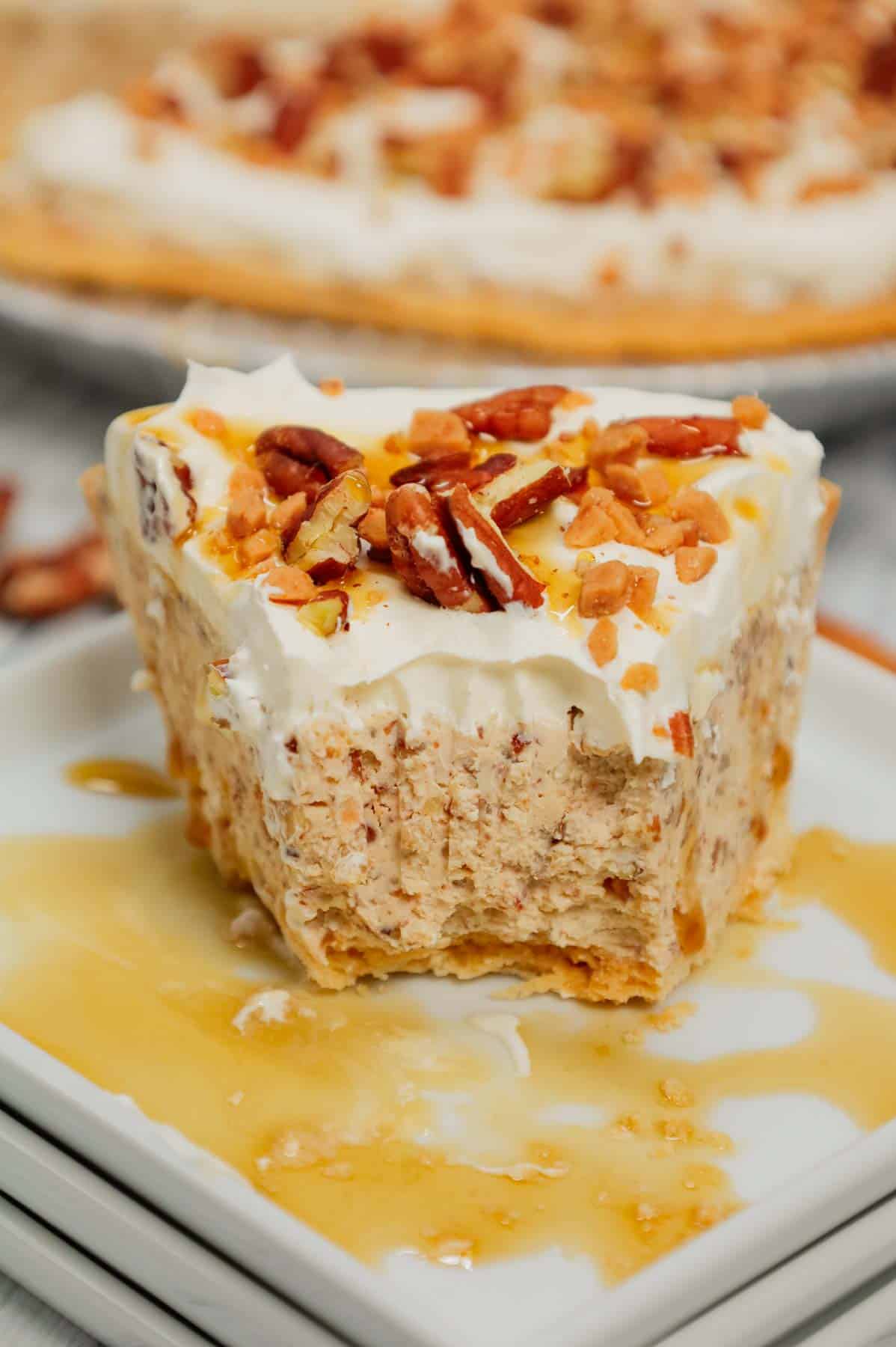 Pecan Cream Pie is an easy dessert recipe using a store bought pie crust and a filling made from cream cheese, crushed pecans, toffee bits, maple syrup, brown sugar and Cool Whip.