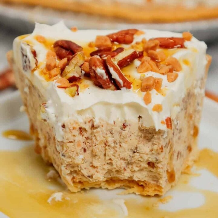 Pecan Cream Pie is an easy dessert recipe using a store bought pie crust and a filling made from cream cheese, crushed pecans, toffee bits, maple syrup, brown sugar and Cool Whip.