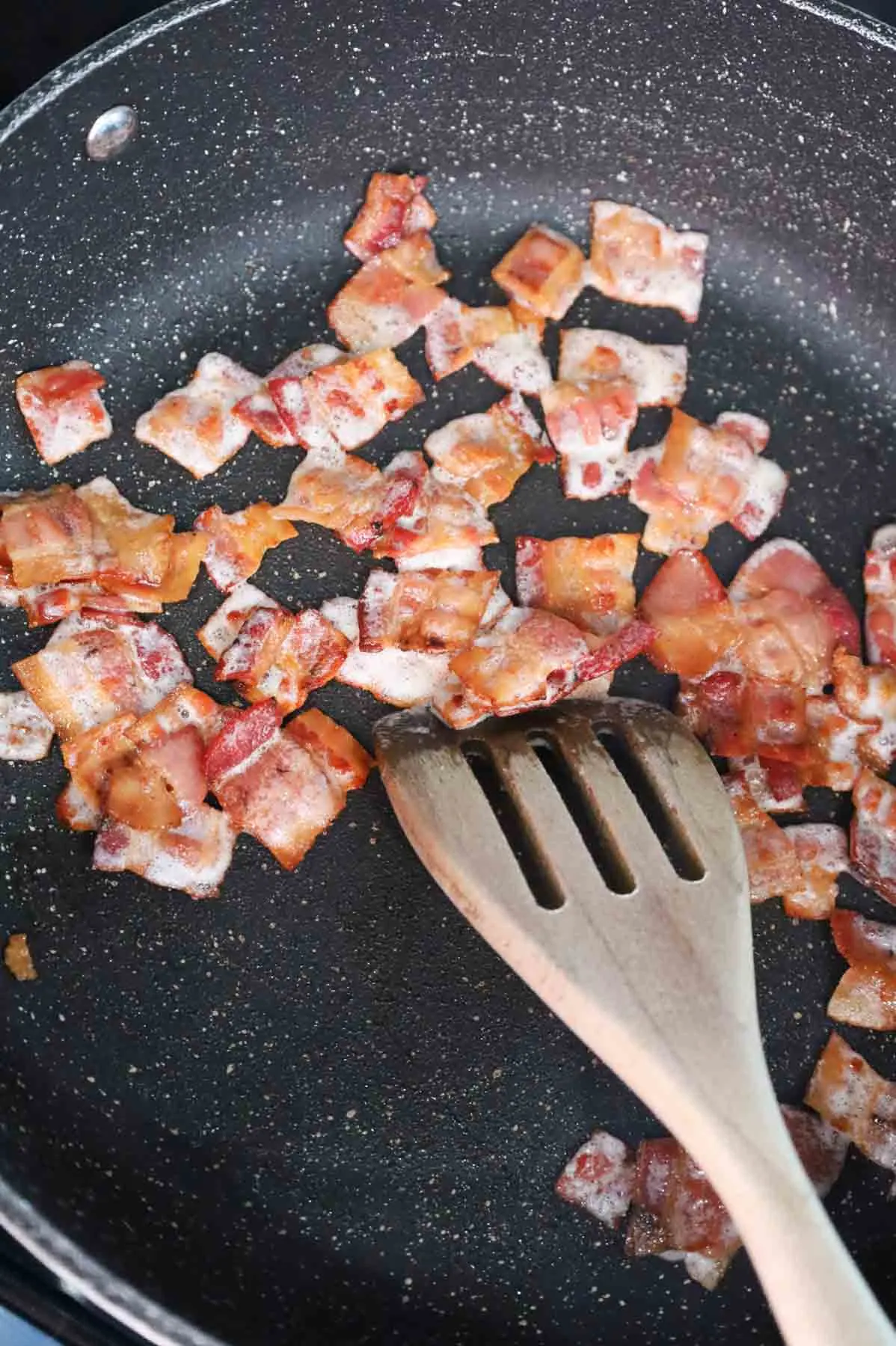 crispy bacon pieces in a skillet