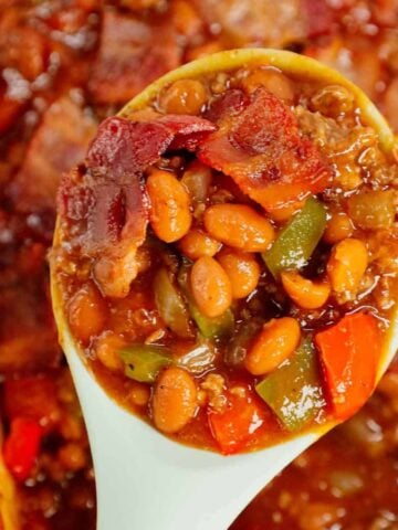 Baked Beans with Ground Beef is a hearty dinner recipe loaded with red and green bell peppers, onions, bacon and Bush's Original baked beans all baked together in a sweet and savoury barbecue sauce.