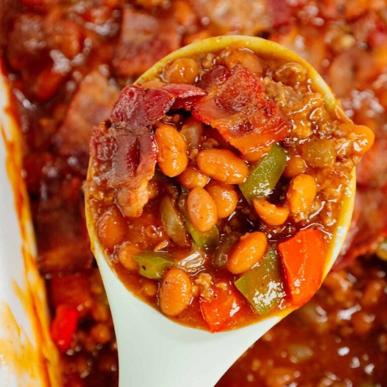 Baked Beans with Ground Beef is a hearty dinner recipe loaded with red and green bell peppers, onions, bacon and Bush's Original baked beans all baked together in a sweet and savoury barbecue sauce.