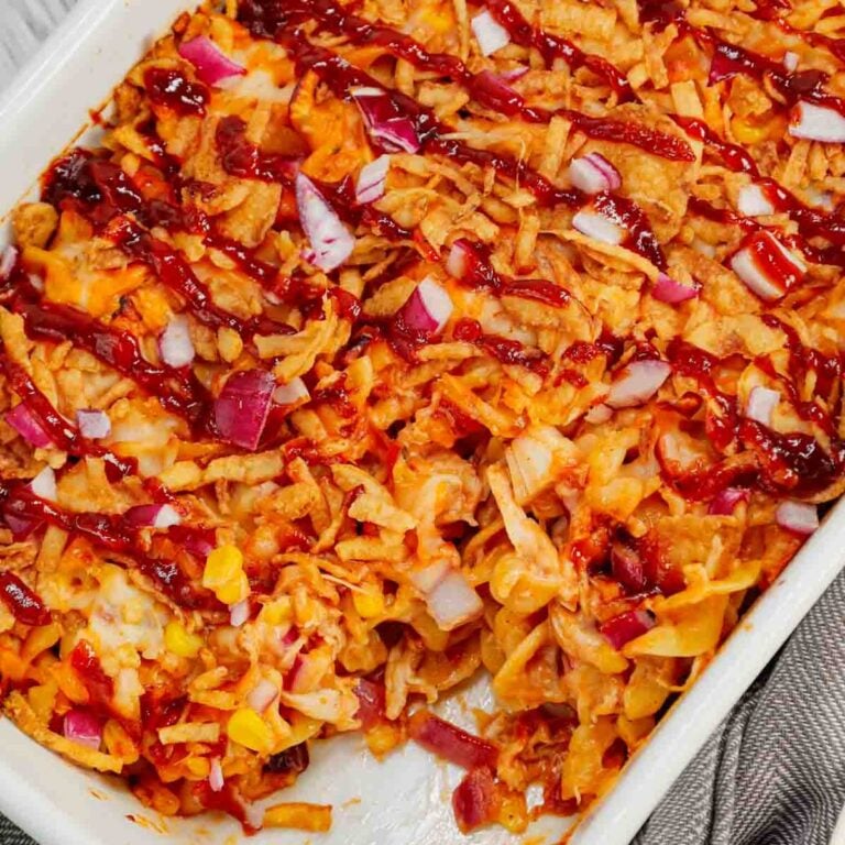 BBQ Chicken Casserole is a hearty dish loaded with egg noodles, shredded rotisserie chicken, diced red onions, corn, cream of chicken soup, barbecue sauce, cheese and French's crispy fried onions.