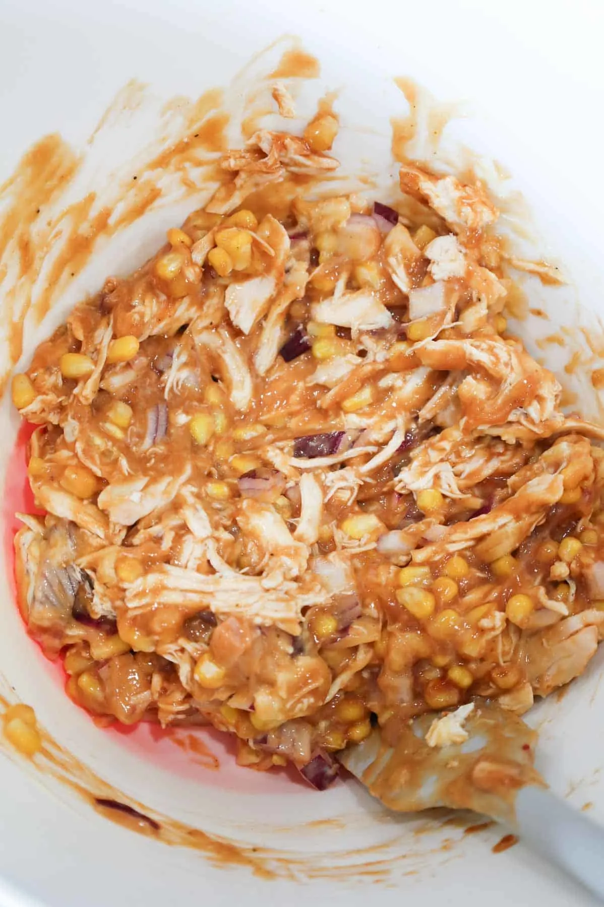 shredded chicken, cream of chicken and bbq sauce mixture in a bowl