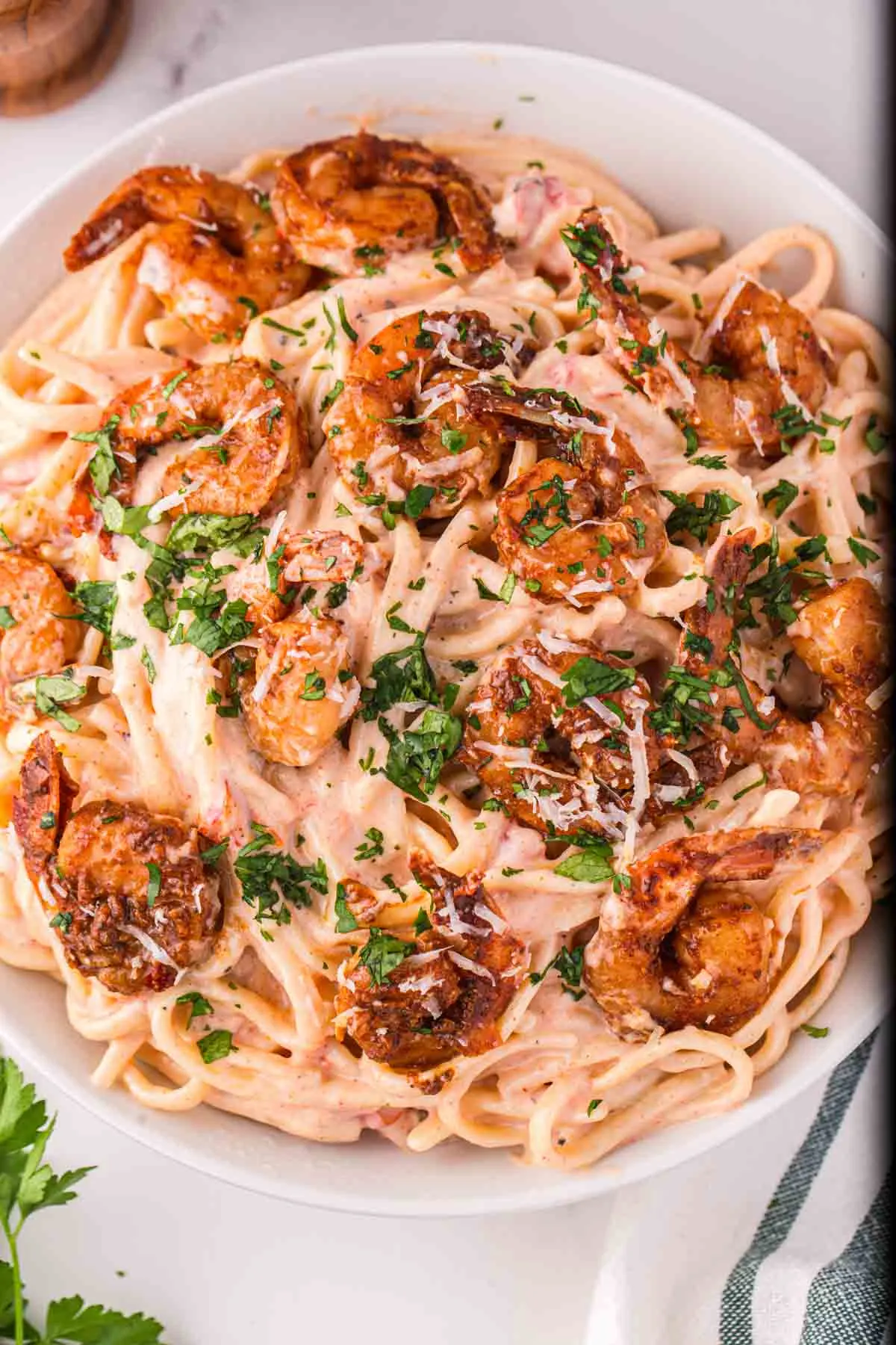 Cajun Shrimp Pasta is a delicious dinner recipe with seasoned Cajun shrimp served over linguine noodles in a flavourful creamy sauce.