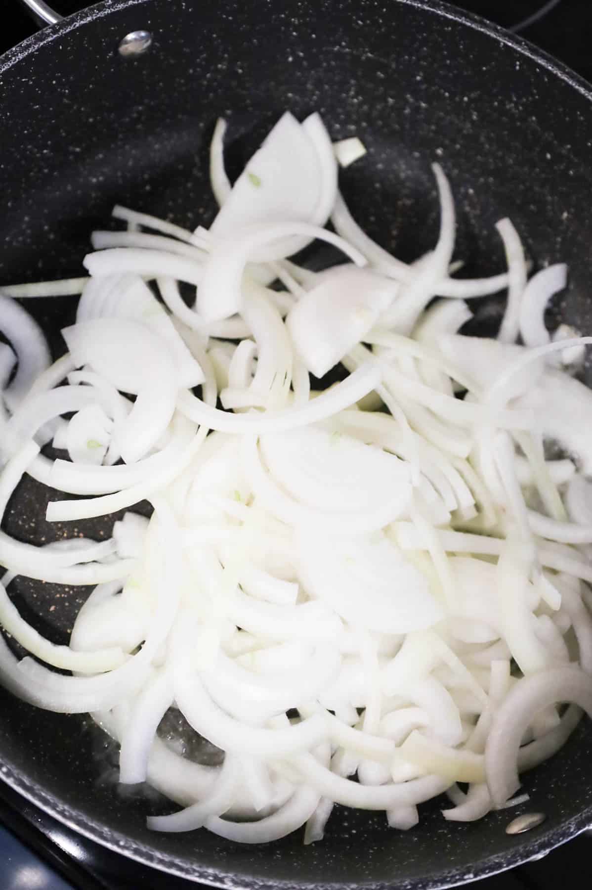 sliced onions in a skillet