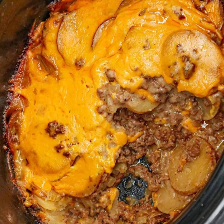 Crock Pot Hamburger Potato Casserole is a hearty slow cooker dinner loaded with ground beef, sliced potatoes, sliced onions, cheddar soup, cream of mushroom soup and shredded cheddar cheese.