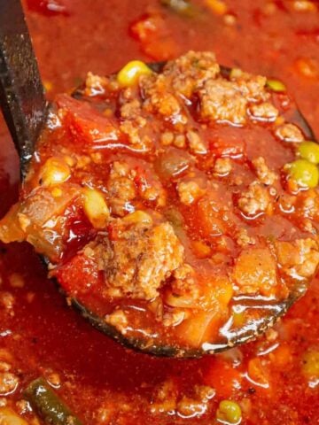 Crock Pot Hamburger Soup is hearty slow cooker dish loaded with ground beef, frozen mixed vegetables, diced tomatoes, tomato sauce and beef broth.