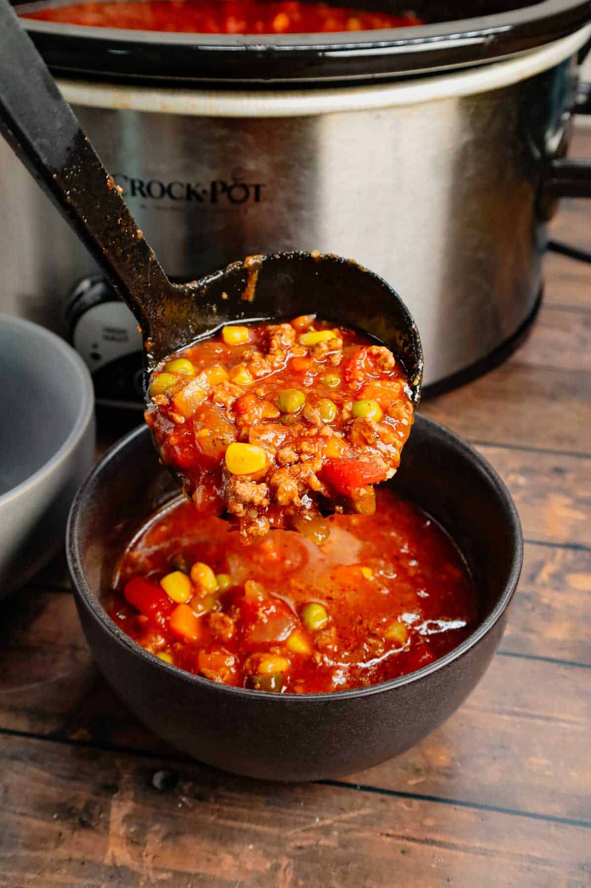 Crock Pot Hamburger Soup is hearty slow cooker dish loaded with ground beef, frozen mixed vegetables, diced tomatoes, tomato sauce and beef broth.