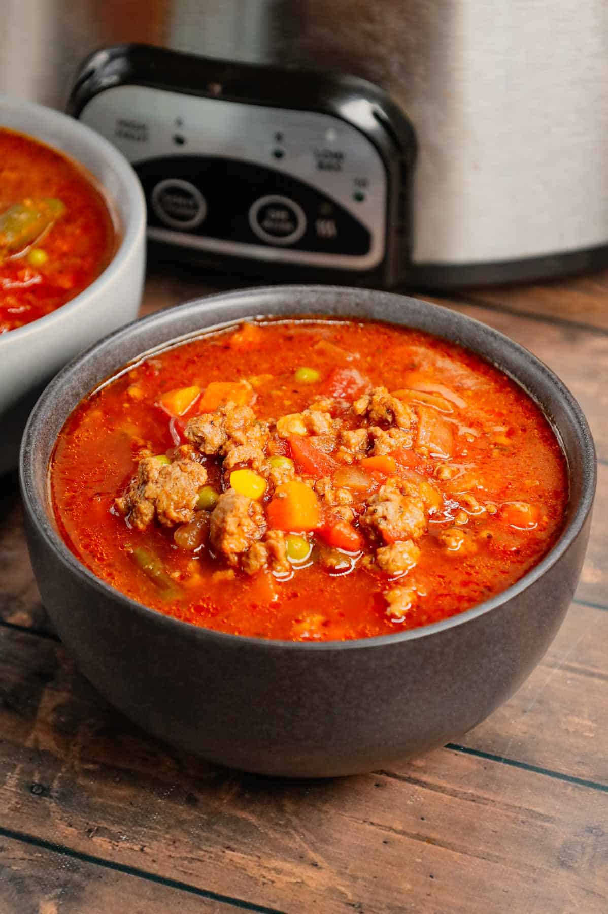 Crock Pot Hamburger Soup is hearty slow cooker dish loaded with ground beef, frozen mixed vegetables, diced tomatoes, tomato sauce and beef broth.