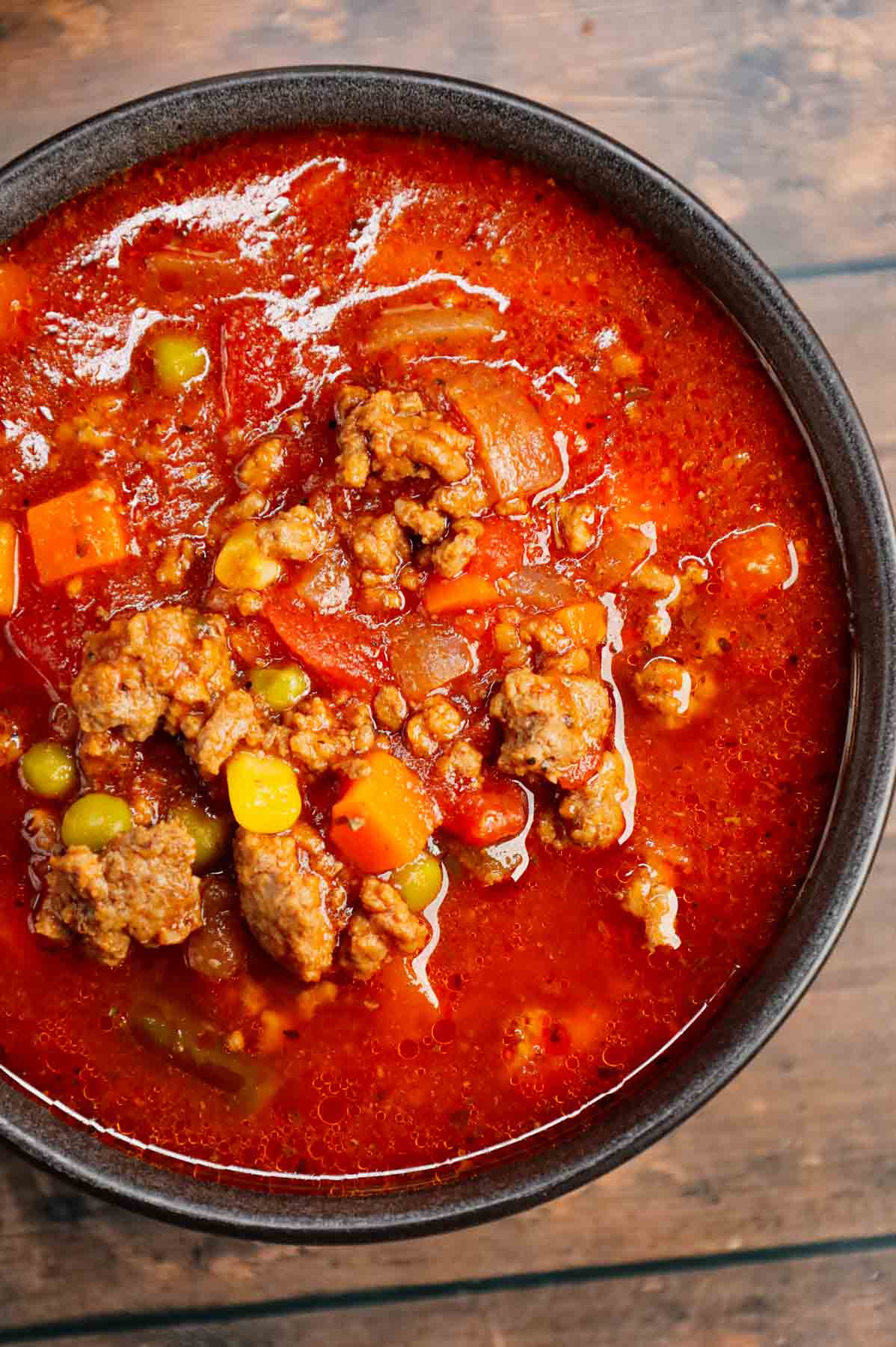 Crock Pot Hamburger Soup is hearty slow cooker dish loaded with ground beef, frozen mixed vegetables, diced tomatoes, tomato sauce and beef broth.