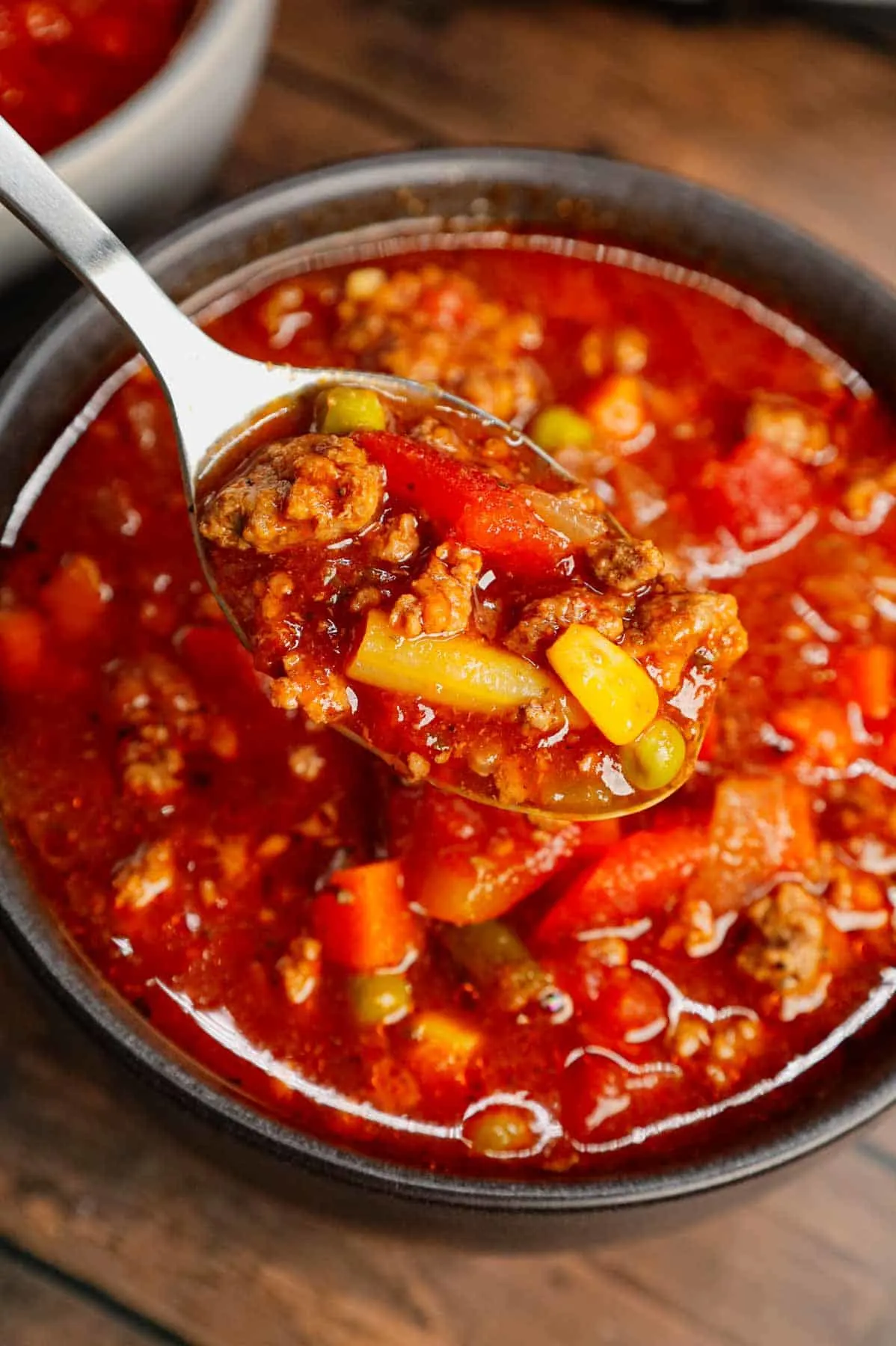 Crock Pot Hamburger Soup is hearty slow cooker dish loaded with ground beef, frozen mixed vegetables, diced tomatoes, tomato sauce and beef broth.