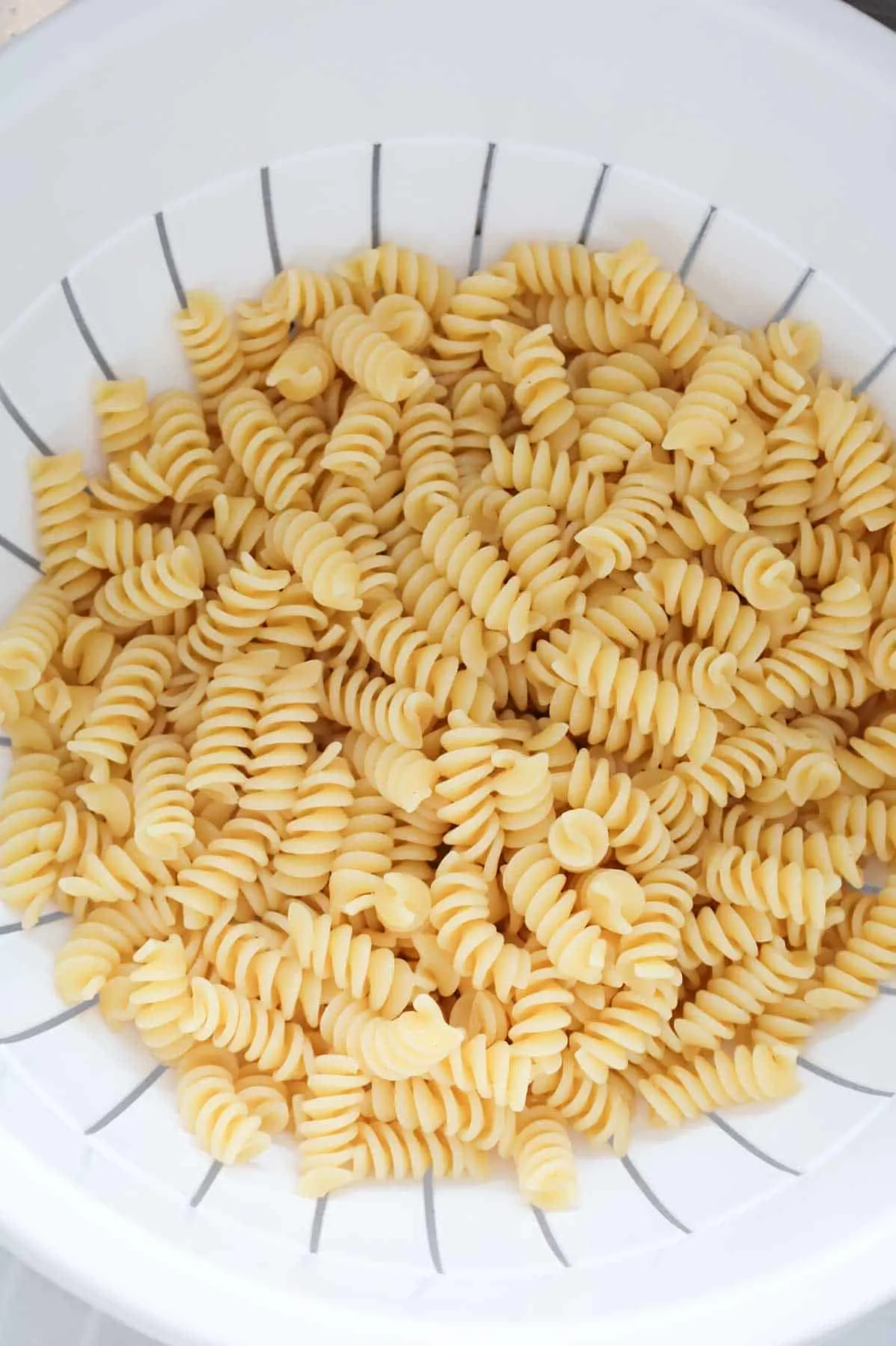 cooked rotini in a colander