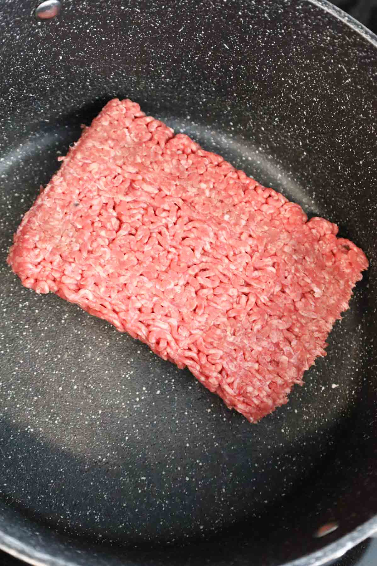 raw ground beef in a pot