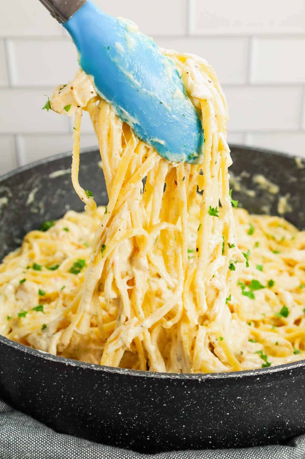 Chicken Alfredo Linguine is a delicious pasta recipe with a creamy garlic parmesan sauce and loaded with shredded rotisserie chicken.