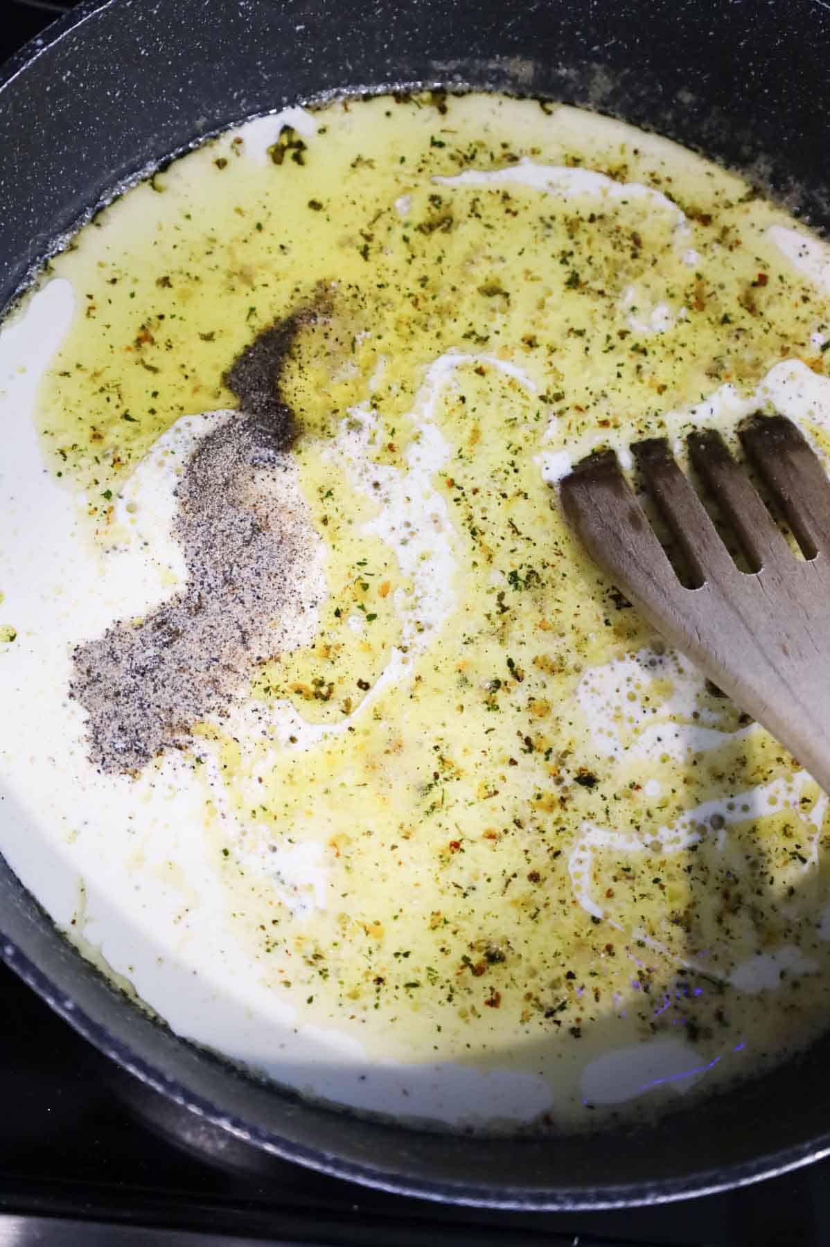 heavy cream, salt and pepper added to skillet with butter and garlic
