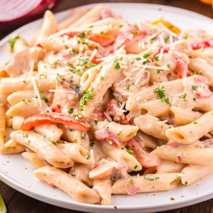 Creamy Chicken Fajita Pasta is a hearty pasta recipe loaded with chicken breast strips, sliced bell peppers, fajita seasoning, fire-roasted Rotel, penne noodles and pepper jack cheese.