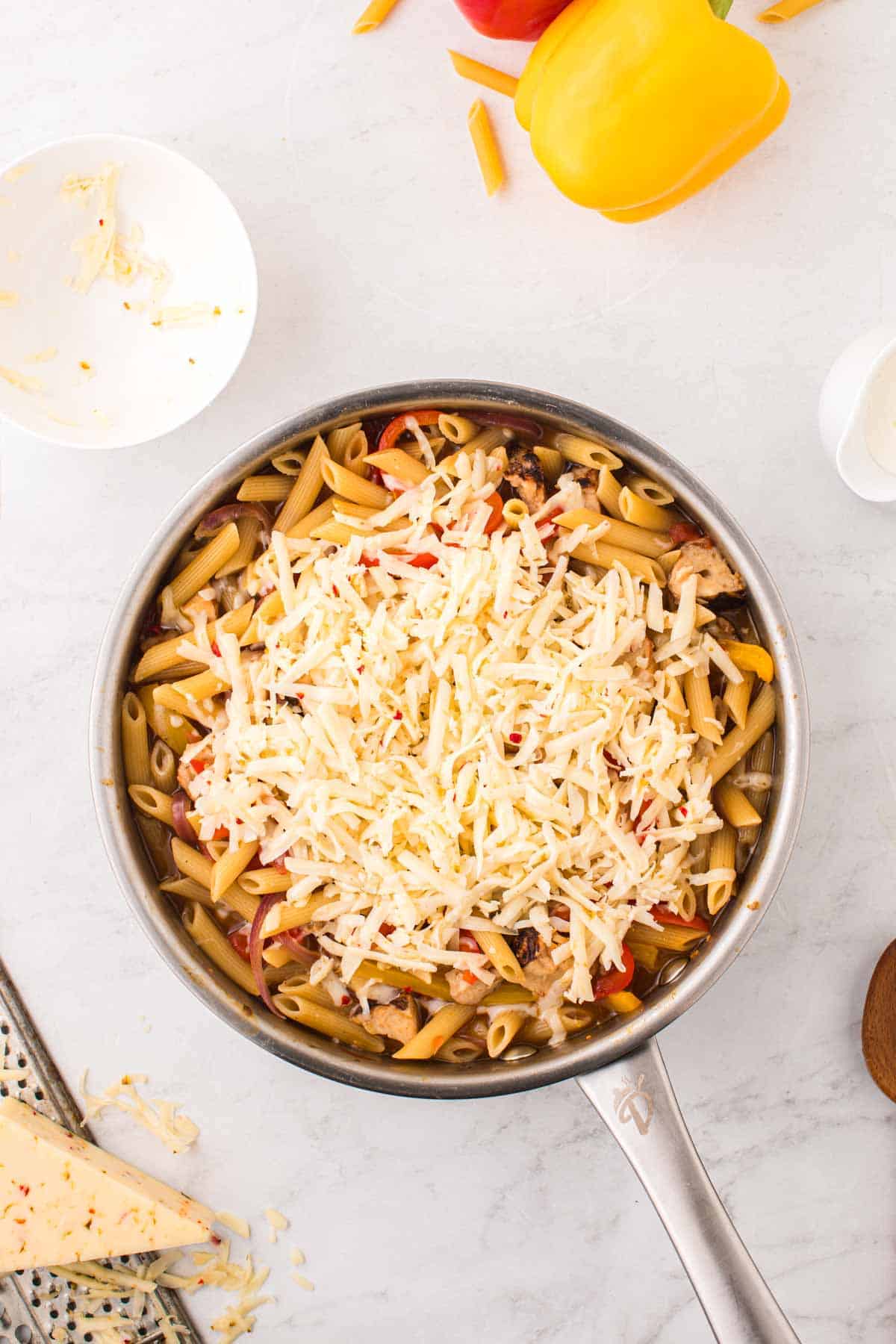 pepper jack cheese added to skillet with chicken penne pasta