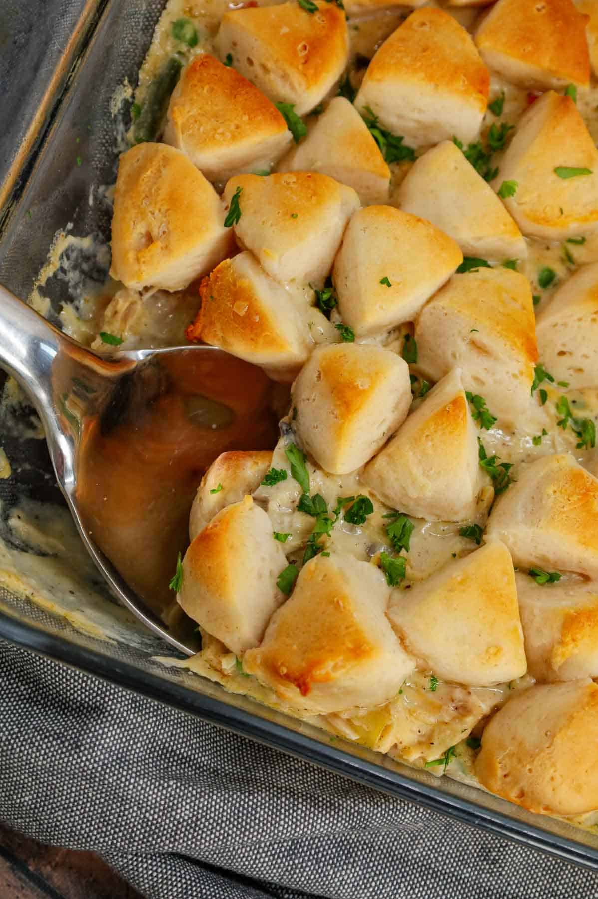 Chicken Pot Pie Casserole is a hearty casserole loaded with shredded rotisserie chicken, frozen mixed vegetables, cream of mushroom soup, cream of chicken soup, milk, grated parmesan cheese and chopped Pillsbury biscuits.