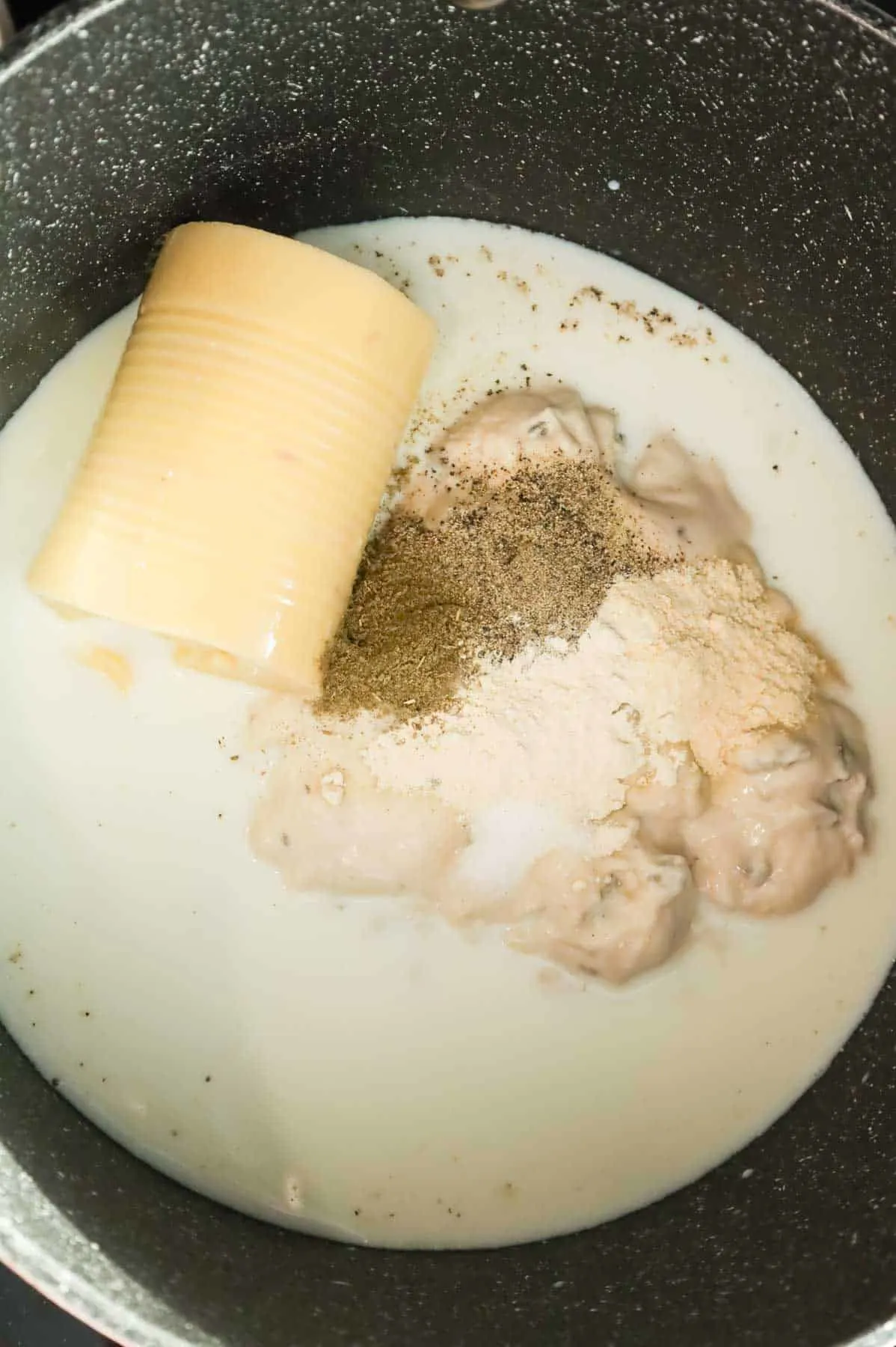 seasoning, cream of mushroom soup, cream of chicken soup and milk in a large pot