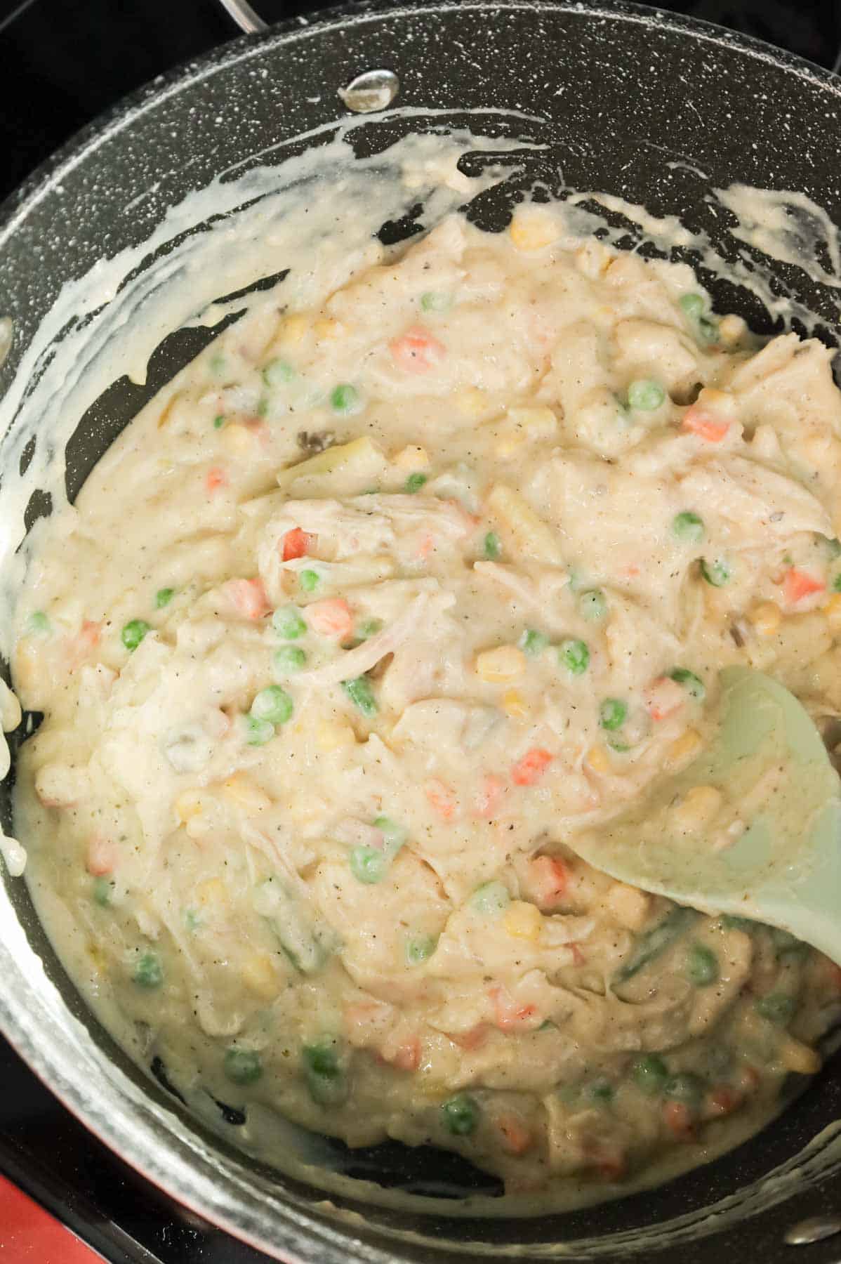 creamy chicken and vegetable mixture in a large pot