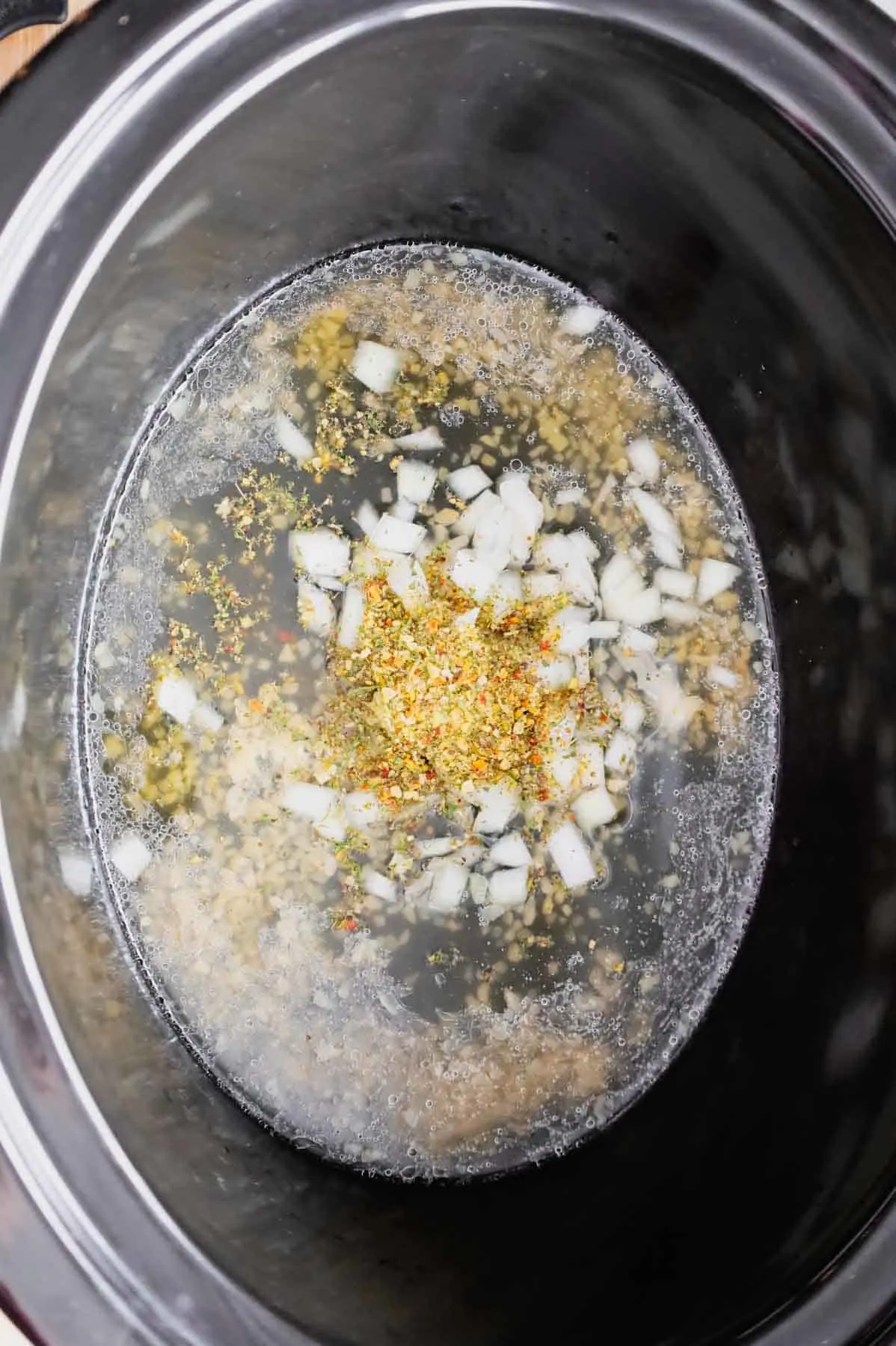 Creamy Crock Pot Parmesan Garlic Chicken served over pasta