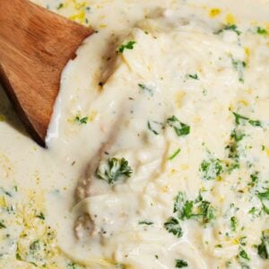 Crock Pot Parmesan Garlic Chicken is a rich and delicious slow cooker dish made with boneless, skinless chicken breasts in a creamy sauce loaded with minced garlic, parmesan cheese, Italian seasoning, fresh chopped parsley, cream cheese and mozzarella cheese.