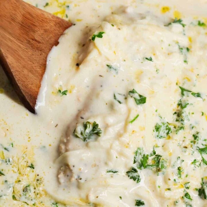 Crock Pot Parmesan Garlic Chicken is a rich and delicious slow cooker dish made with boneless, skinless chicken breasts in a creamy sauce loaded with minced garlic, parmesan cheese, Italian seasoning, fresh chopped parsley, cream cheese and mozzarella cheese.