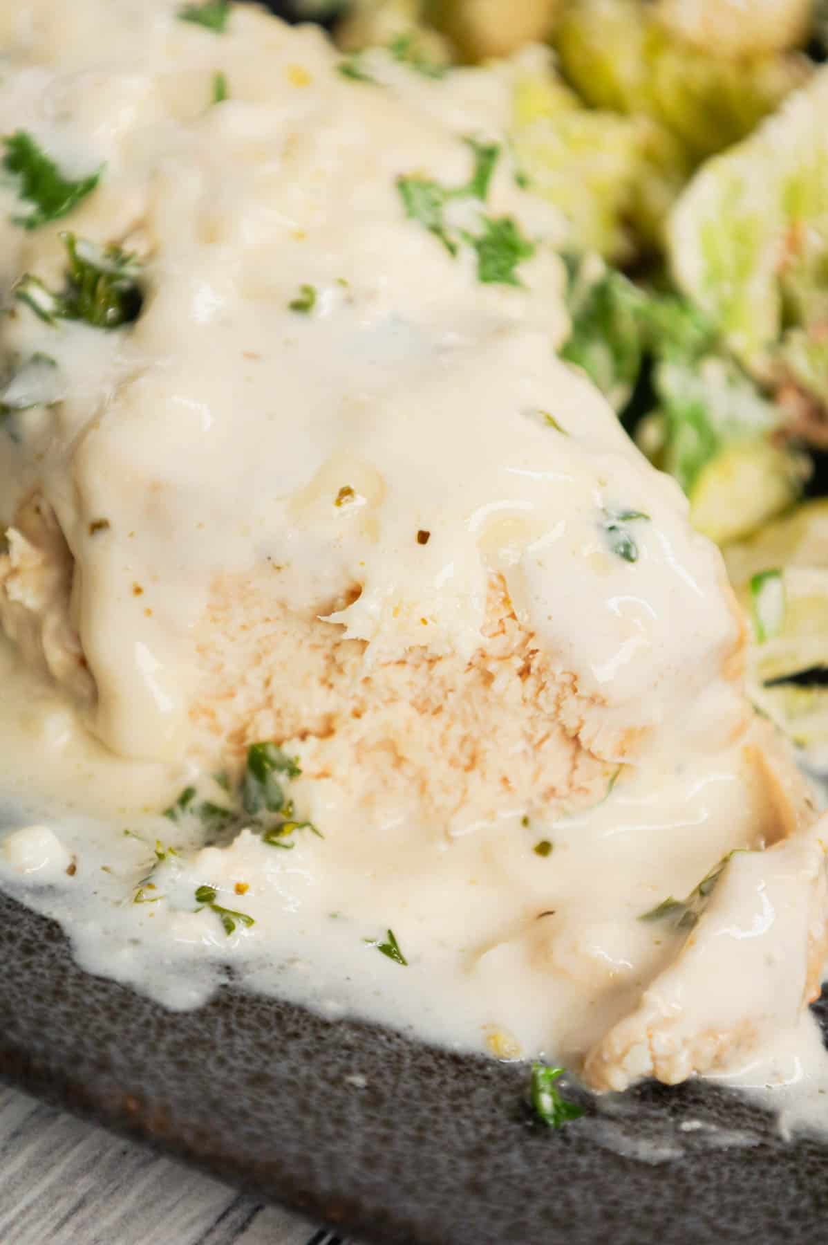 Crock Pot Parmesan Garlic Chicken is a rich and delicious slow cooker dish made with boneless, skinless chicken breasts in a creamy sauce loaded with minced garlic, parmesan cheese, Italian seasoning, fresh chopped parsley, cream cheese and mozzarella cheese.