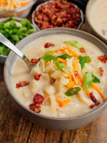 Hash Brown Potato Soup is a hearty soup recipe made with frozen diced hash brown potatoes, chicken broth, milk, diced onions, bacon crumble and cheddar cheese.