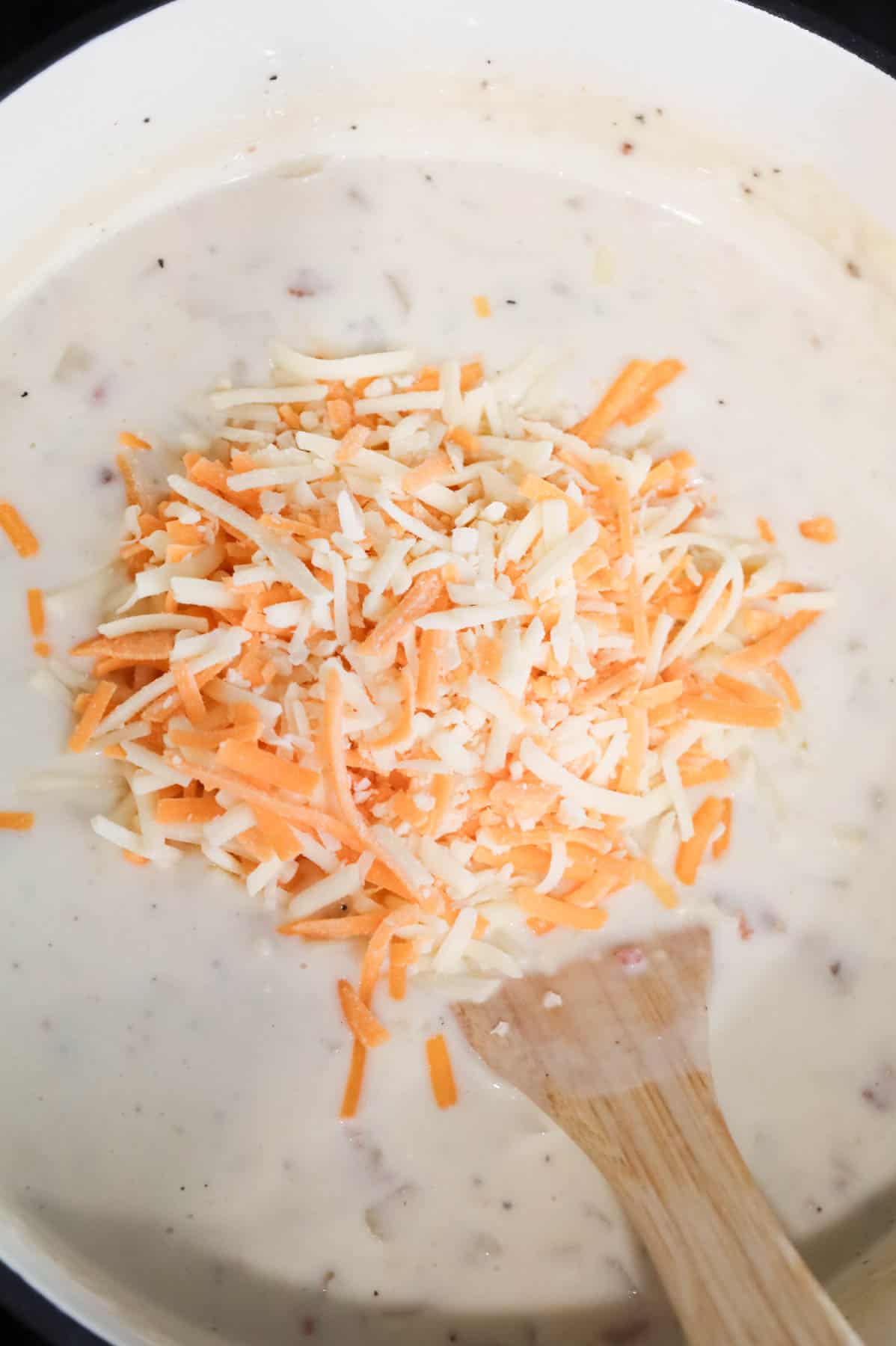 shredded cheddar added to hash brown potato soup