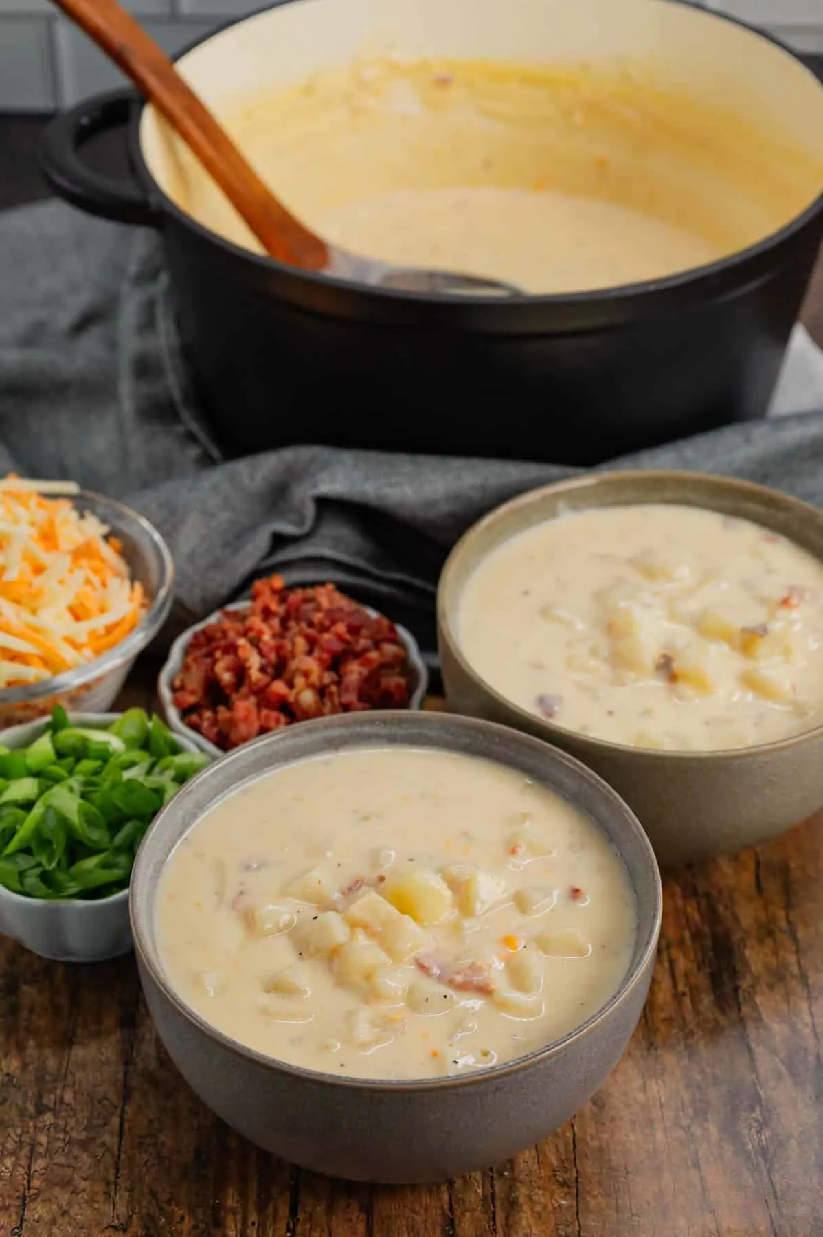 Hash Brown Potato Soup is a hearty soup recipe made with frozen diced hash brown potatoes, chicken broth, milk, diced onions, bacon crumble and cheddar cheese.