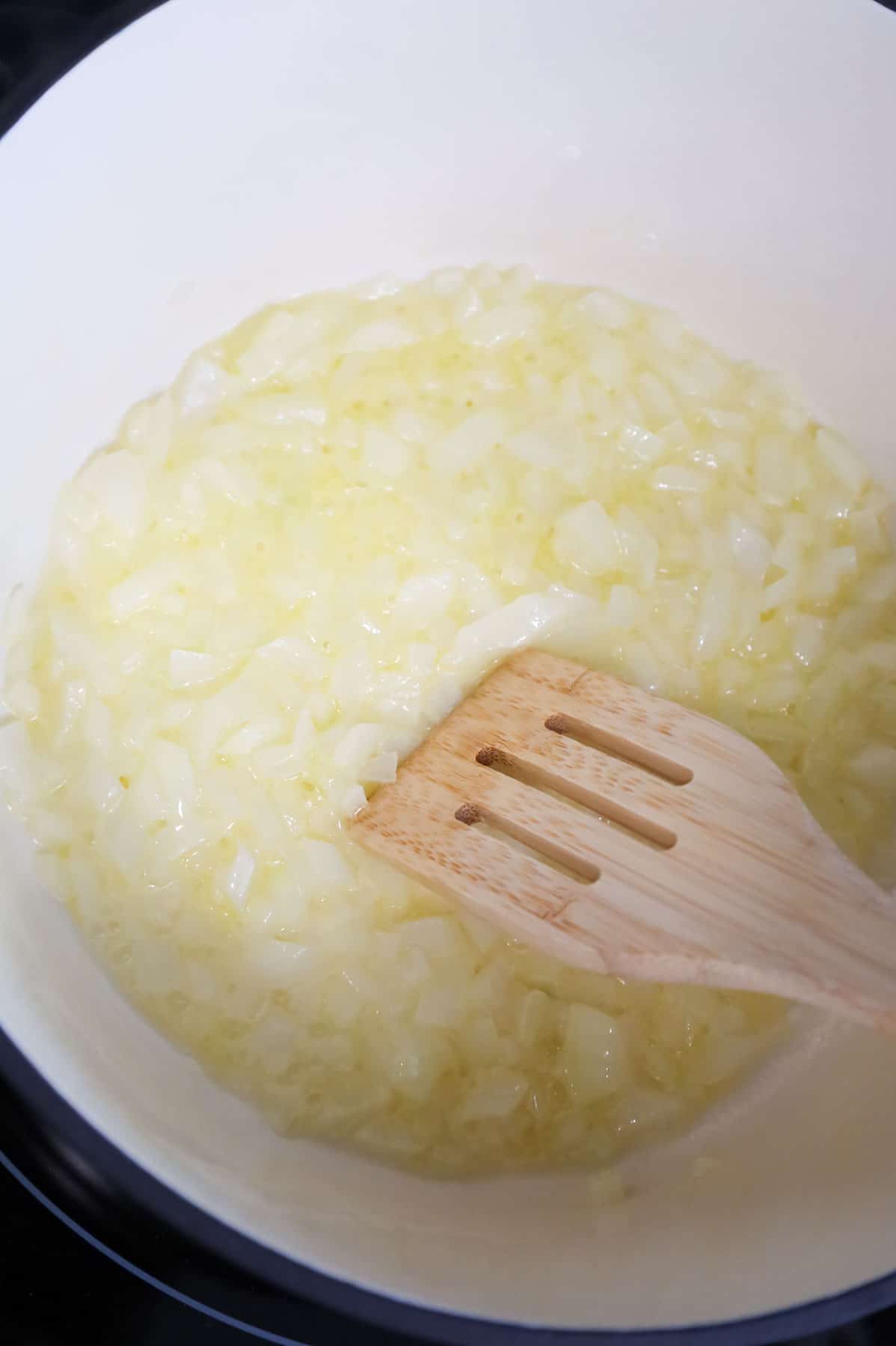 stirring diced onions and melted butter together in a Dutch oven