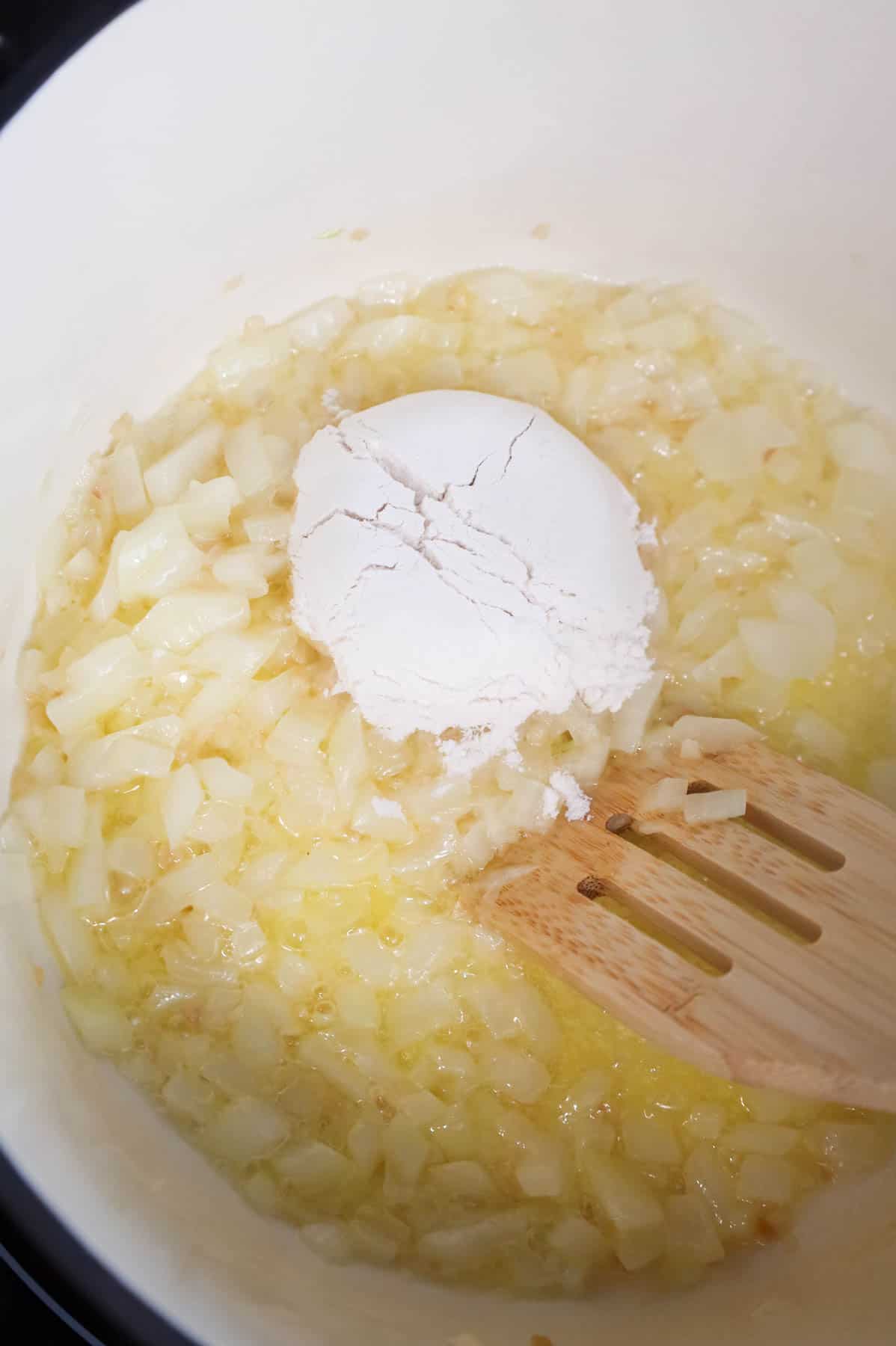 flour added to pot with diced onions and melted butter