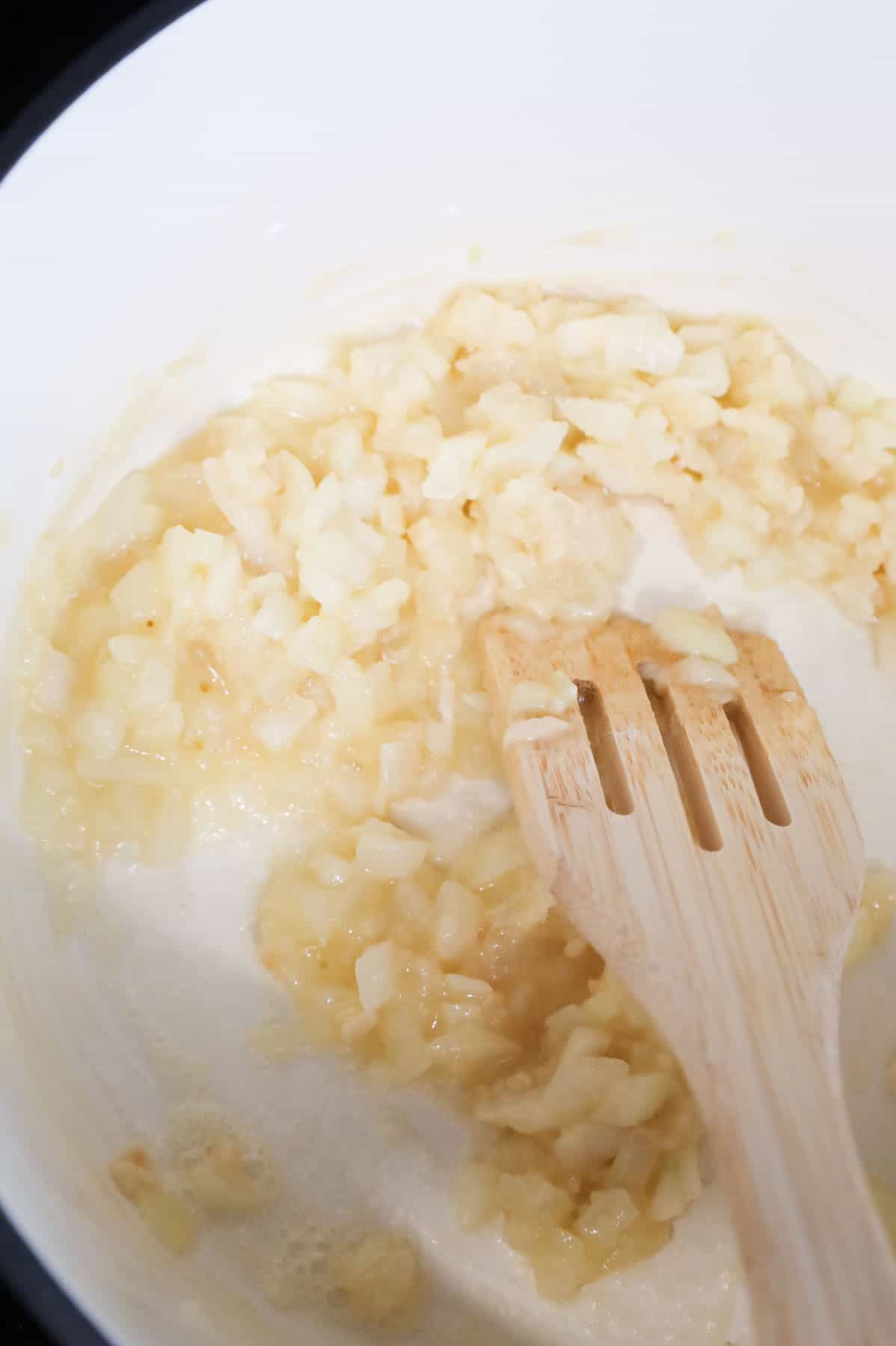 flour, onions and butter mixture cooking in a Dutch oven