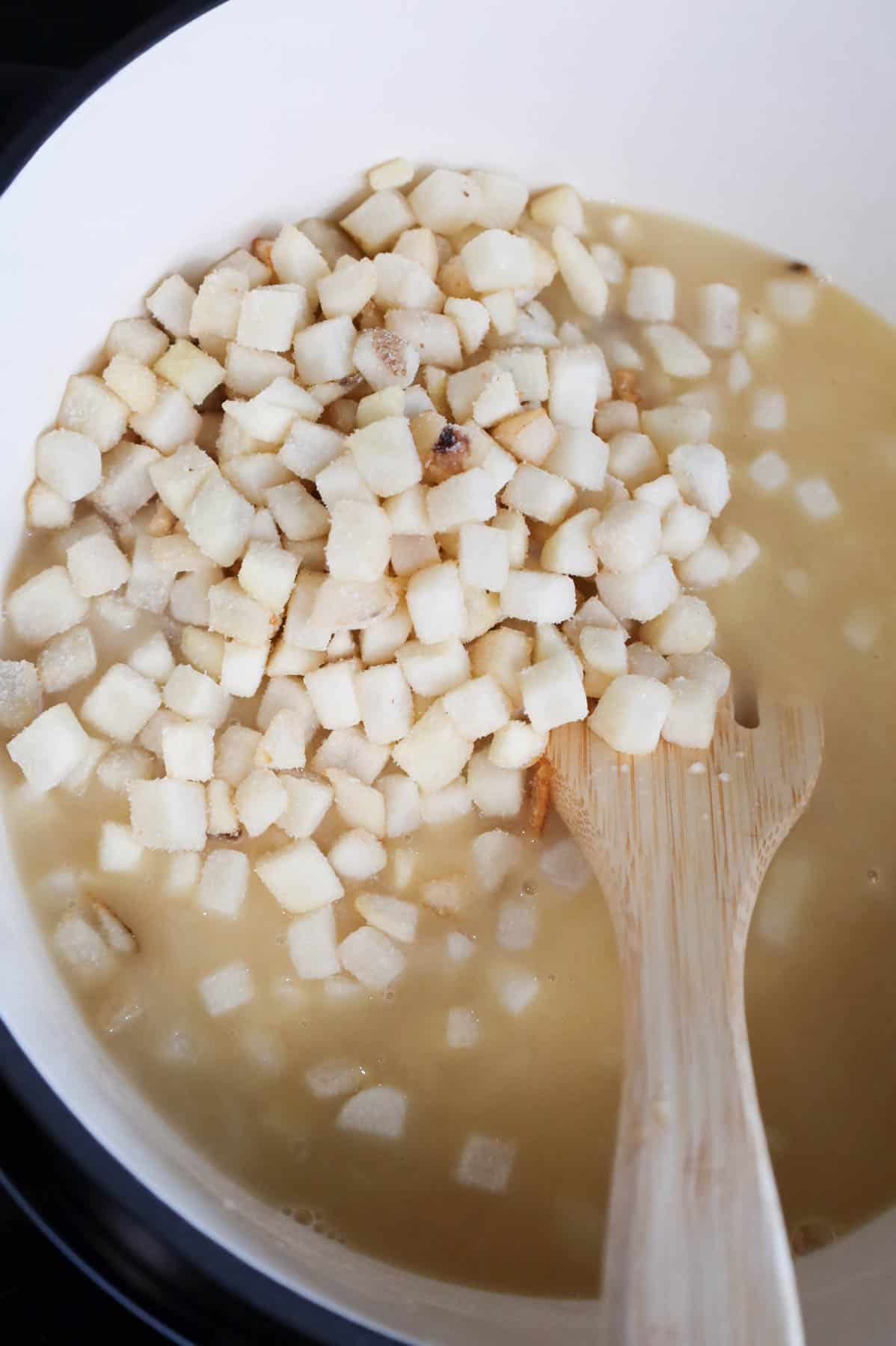 frozen diced hash browns added to pot with broth mixture