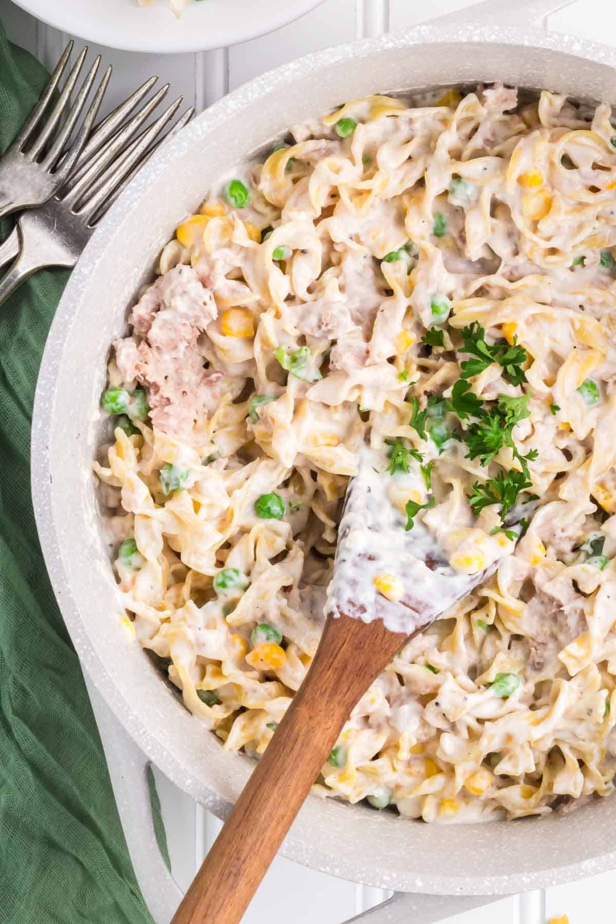 Homemade Tuna Helper is a delicious twist on boxed tuna helper loaded with egg noodles, green peas, corn, cream cheese, parmesan cheese and tuna all in a creamy sauce.