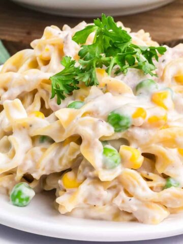 Homemade Tuna Helper is a delicious twist on boxed tuna helper loaded with egg noodles, green peas, corn, cream cheese, parmesan cheese and tuna all in a creamy sauce.