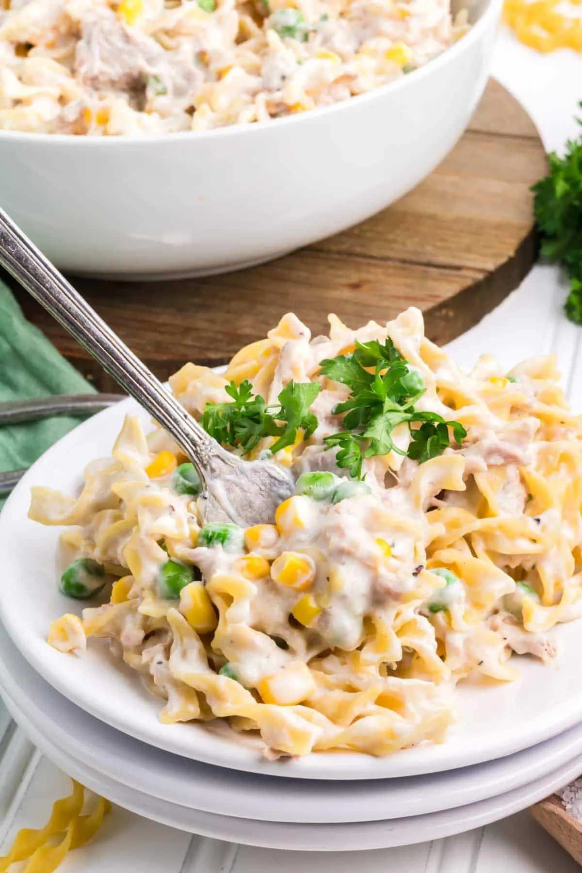 Homemade Tuna Helper is a delicious twist on boxed tuna helper loaded with egg noodles, green peas, corn, cream cheese, parmesan cheese and tuna all in a creamy sauce.