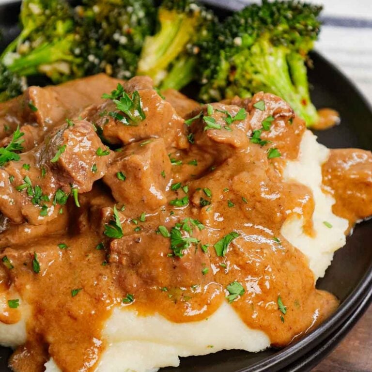 No Peek Beef Tips is a classic comfort food dish with cubes of beef cooked slowly in a delicious gravy made from cream of mushroom soup, beef broth, beef gravy mix and onion soup mix.