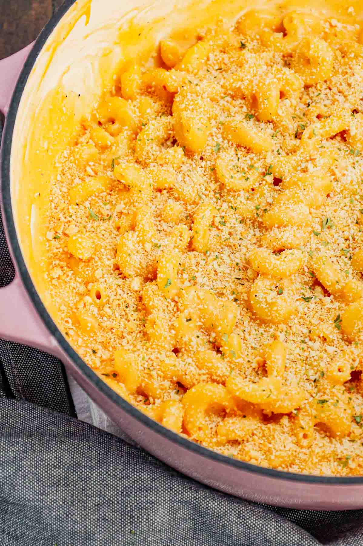 One Pot Mac and Cheese is a creamy and delicious pasta dish made with milk, cavatappi noodles, condensed cheddar soup, shredded cheddar cheese, mozzarella cheese, parmesan cheese and crushed Ritz crackers.