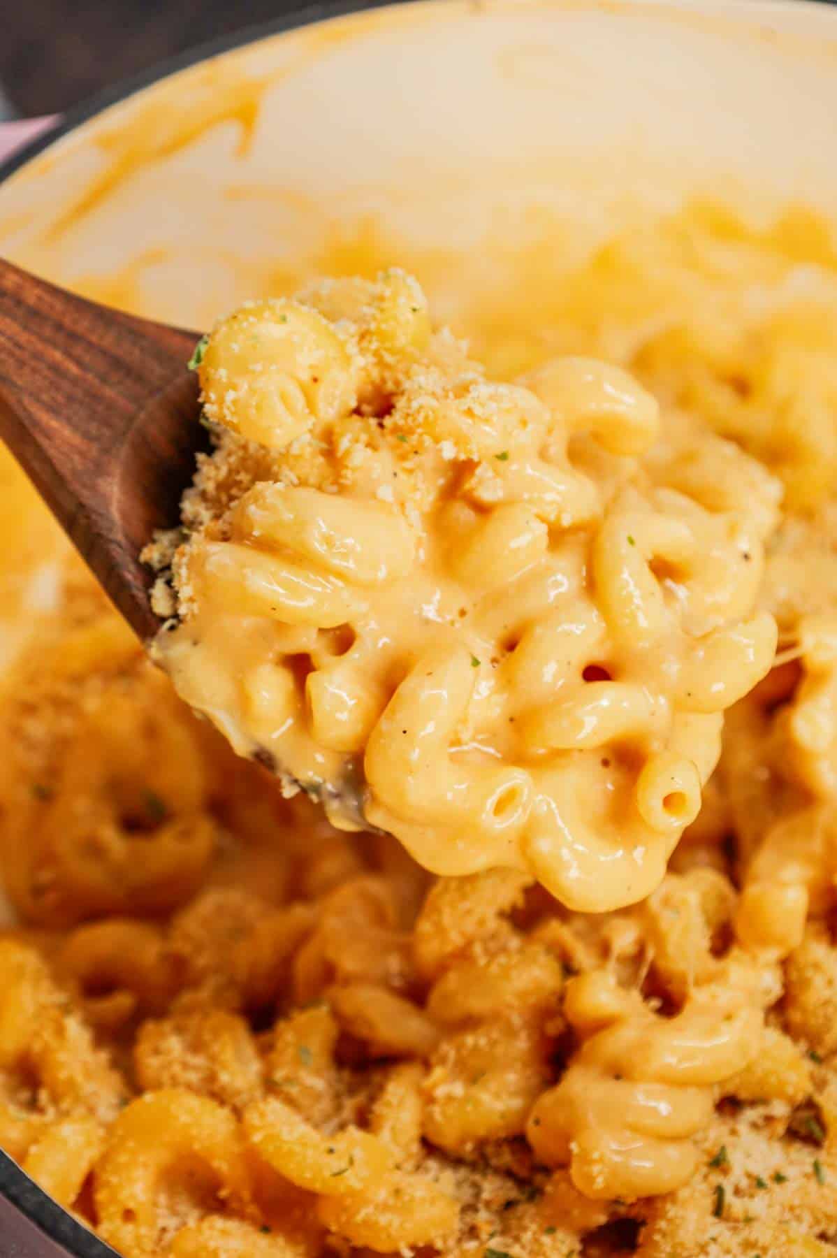 One Pot Mac and Cheese is a creamy and delicious pasta dish made with milk, cavatappi noodles, condensed cheddar soup, shredded cheddar cheese, mozzarella cheese, parmesan cheese and crushed Ritz crackers.
