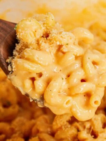 One Pot Mac and Cheese is a creamy and delicious pasta dish made with milk, cavatappi noodles, condensed cheddar soup, shredded cheddar cheese, mozzarella cheese, parmesan cheese and crushed Ritz crackers.