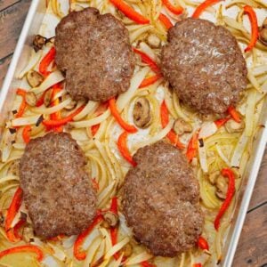 Oven Baked Hamburger Steaks are an easy sheet pan dinner recipe with seasoned ground beef patties cooked along with sliced onions, red bell peppers and mushrooms.