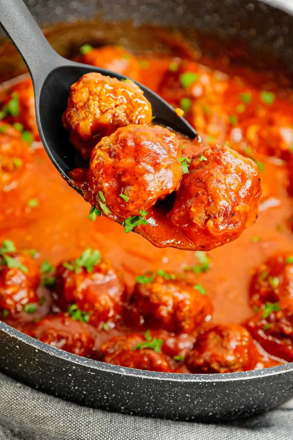 Porcupine Meatballs are delicious meatballs made with ground beef, Minute rice and diced onions all in a flavourful sauce made with condensed tomato soup, Worcestershire sauce and Italian seasoning.
