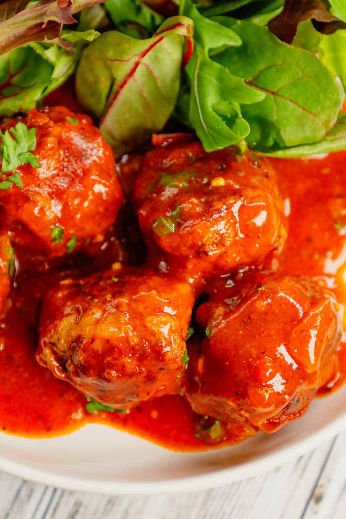 Porcupine Meatballs are delicious meatballs made with ground beef, Minute rice and diced onions all in a flavourful sauce made with condensed tomato soup, Worcestershire sauce and Italian seasoning.