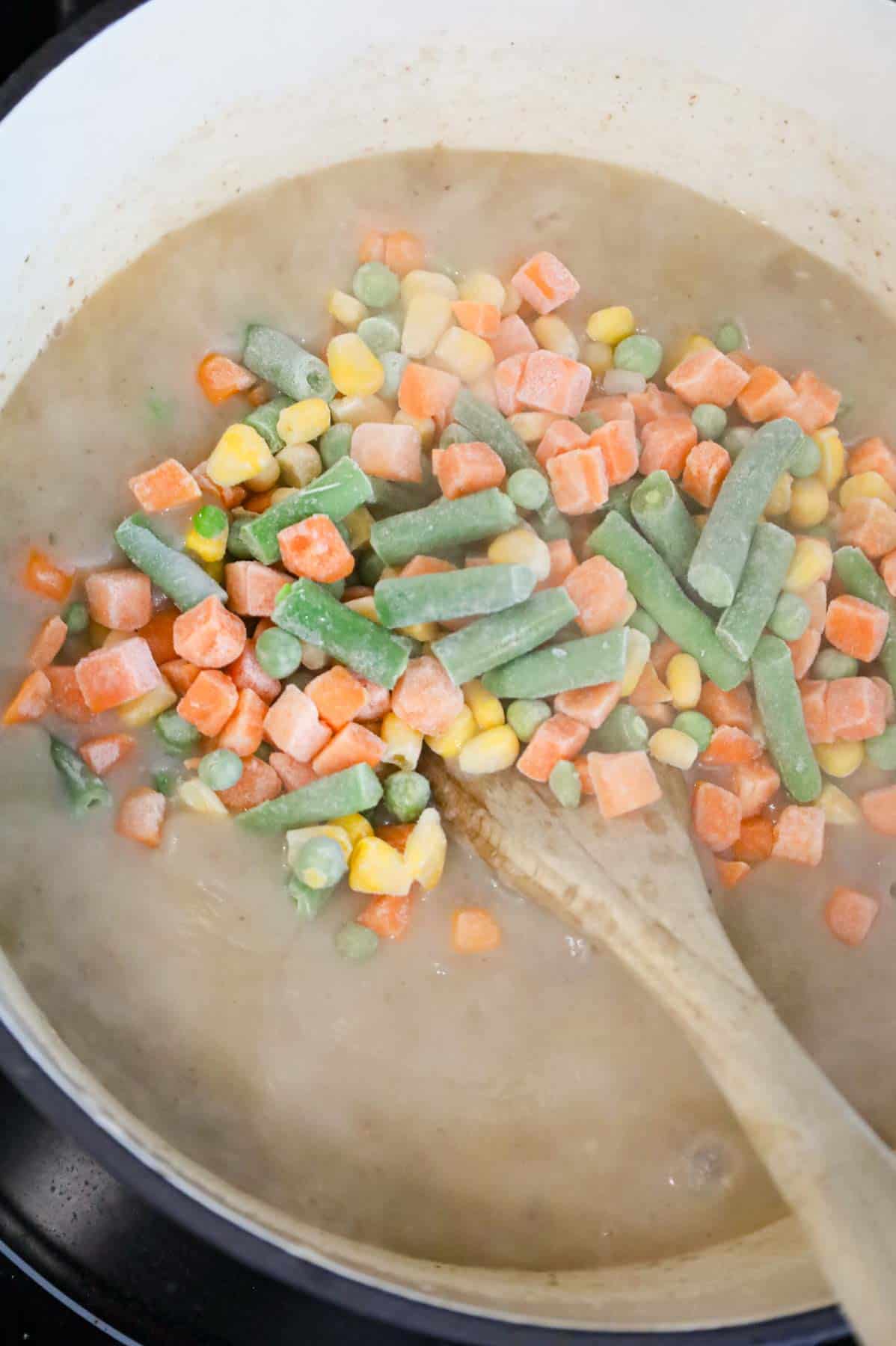 frozen mixed vegetables added to pot with shepherd's pie soup