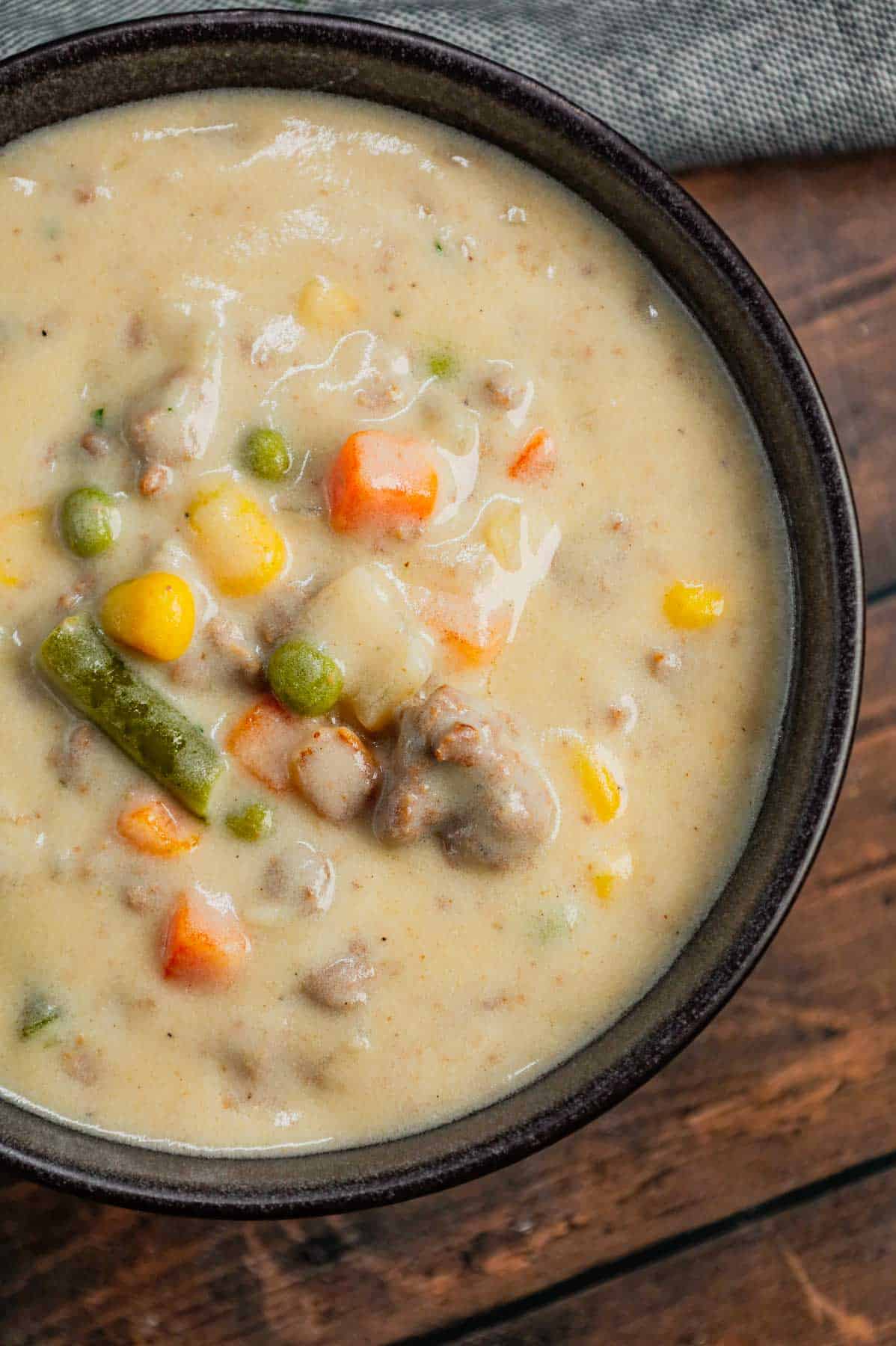 Shepherd's Pie Soup is a hearty soup loaded with instant mashed potatoes, ground beef, chicken broth, half and half, diced onions and frozen mixed vegetables.