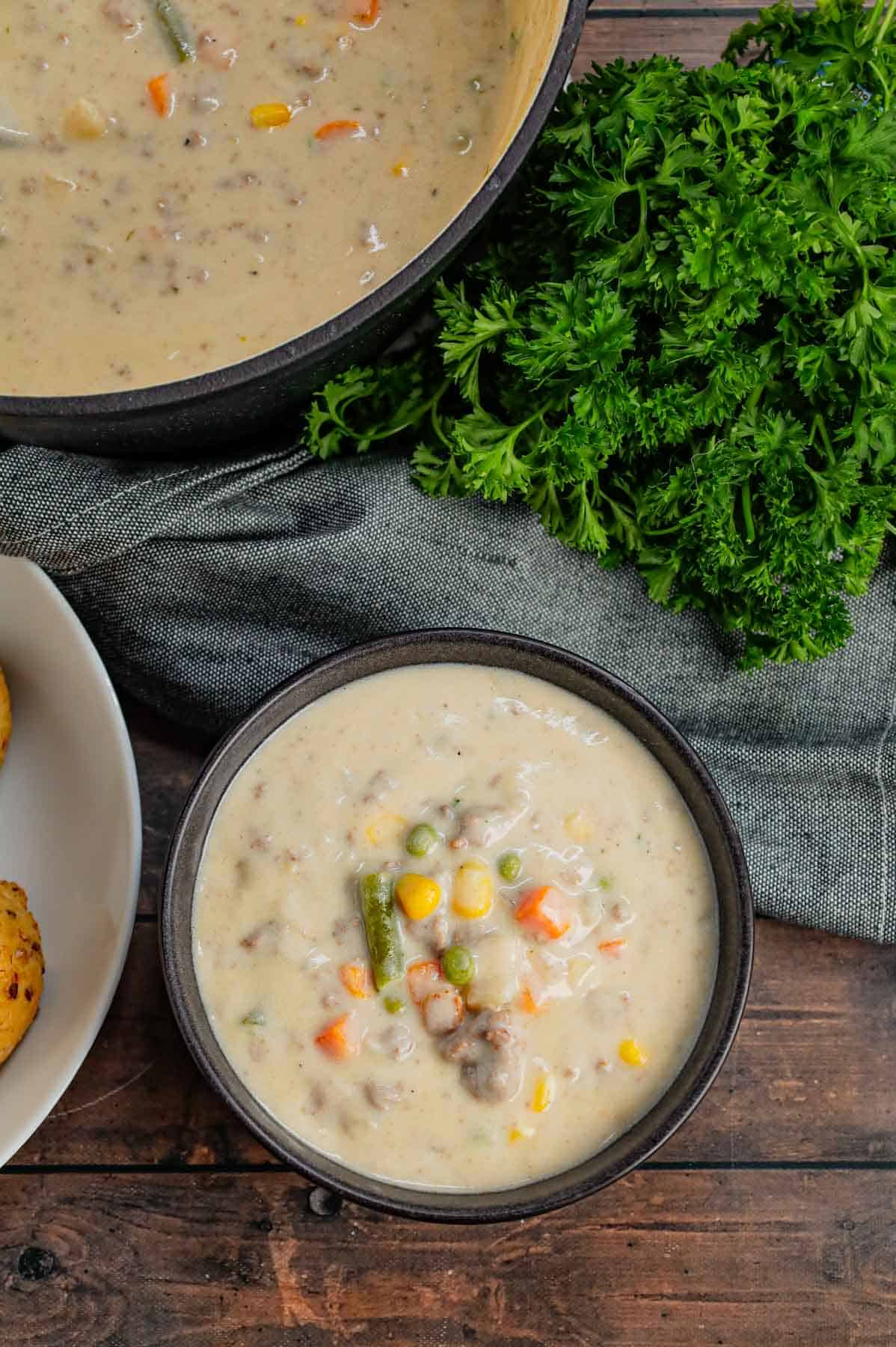 Shepherd's Pie Soup is a hearty soup loaded with instant mashed potatoes, ground beef, chicken broth, half and half, diced onions and frozen mixed vegetables.